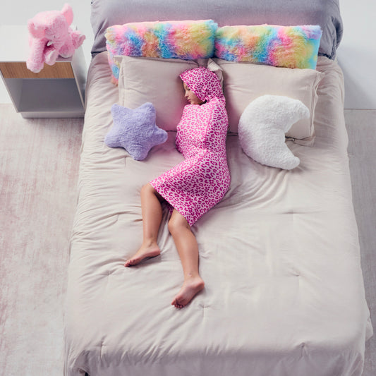kid-sleeping-in-pink-sleep-pod-mini-in-bed