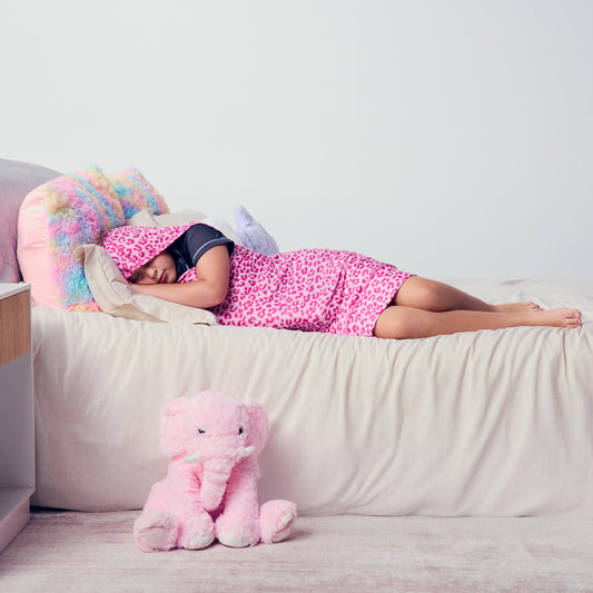 kid-sleeping-in-pink-sleep-pod-mini-in-bed
