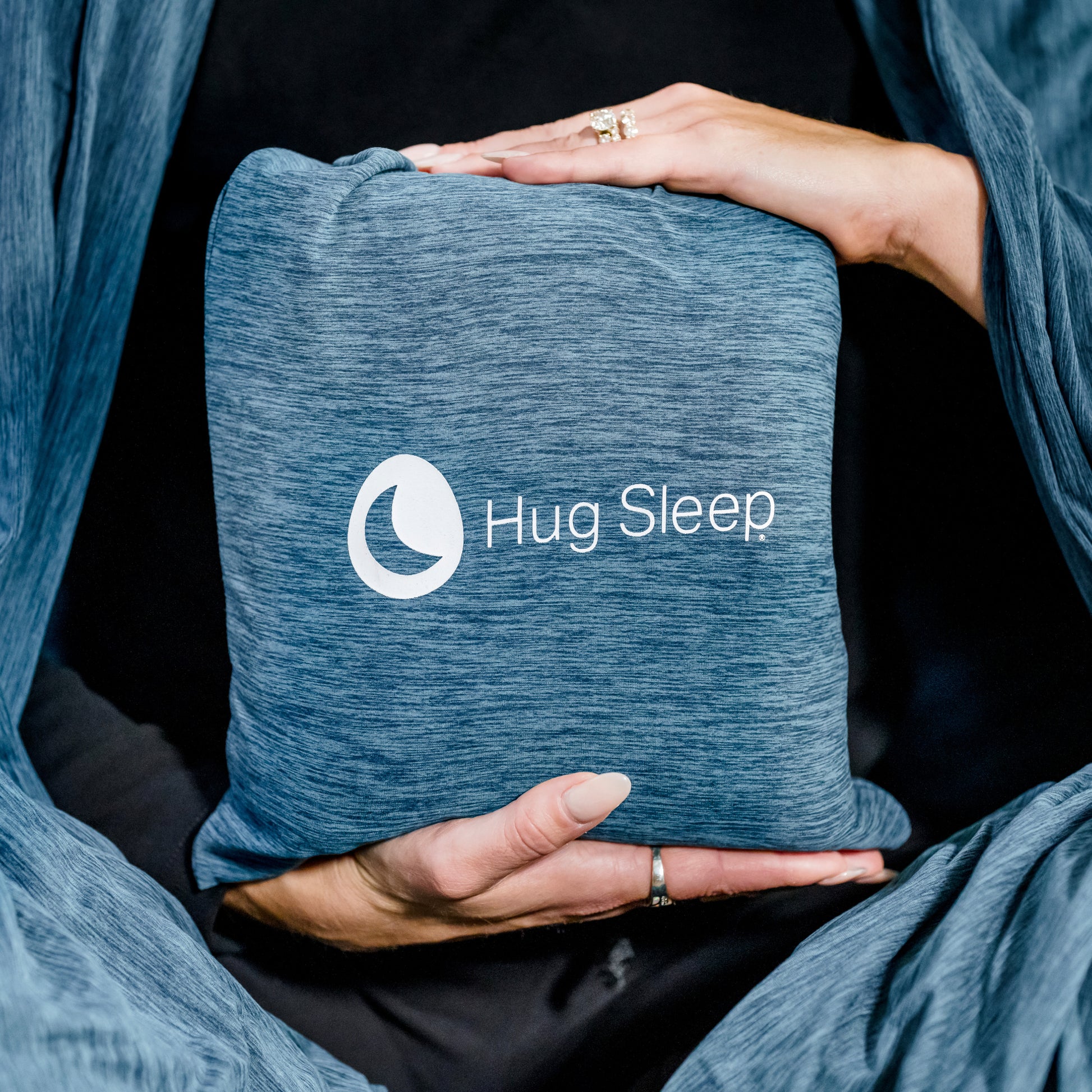 image of hands holding hug stretch bag