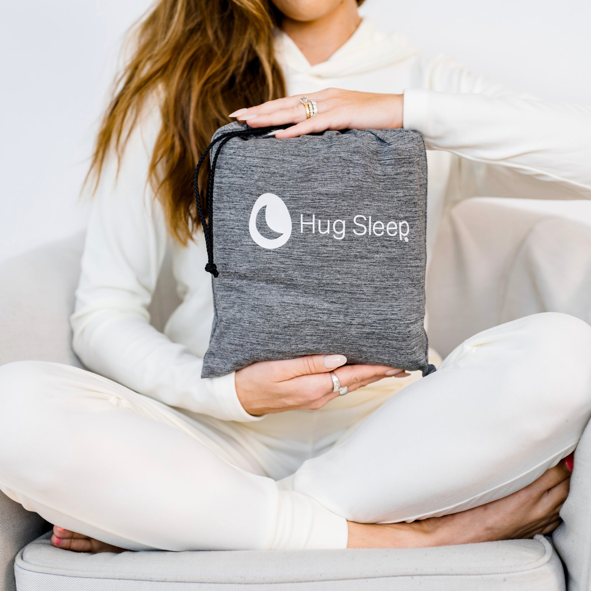woman holding hug wrap drawstring bag