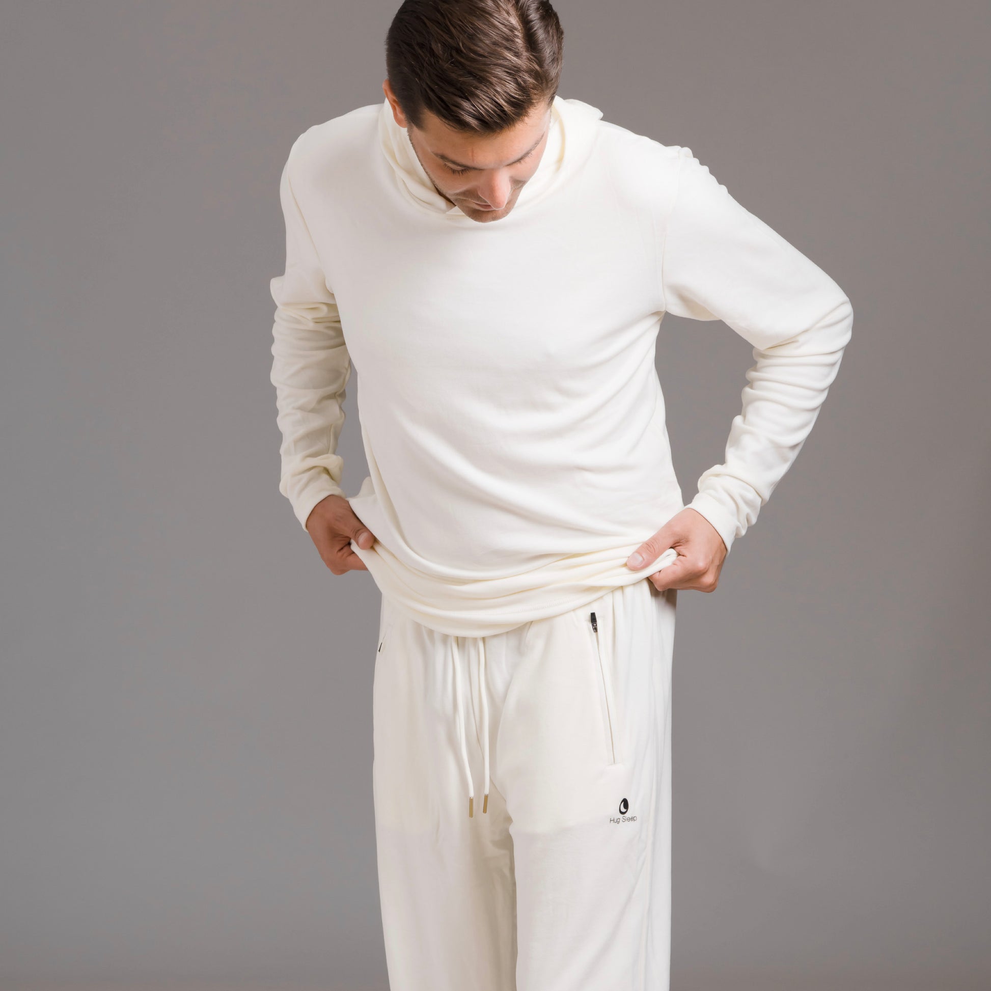 man wearing hug sleep loungewear in cream cream
