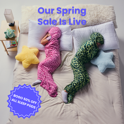 Kid in pink sleep pod and another kid in camo sleep pod laying in bed -  badge that says "BOGO 50% OFF ALL SLEEP PODS" and "OUR SPRING SALE IS LIVE"