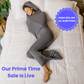 Woman in graphite color sleep pod in bed -  badge that says "BOGO 50% OFF ALL SLEEP PODS" and "OUR PRIME TIME SALE IS LIVE"
