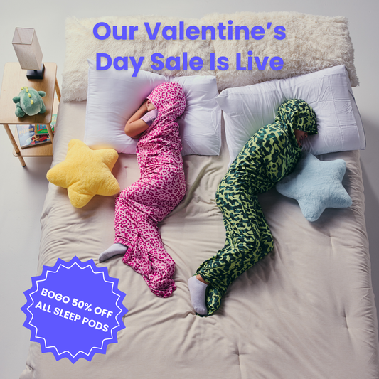 Kid in pink sleep pod and another kid in camo sleep pod laying in bed -  badge that says "BOGO 50% OFF ALL SLEEP PODS" and "OUR VALENTINE'S DAY SALE IS LIVE"