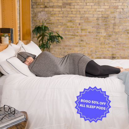Woman in bed in sleep pod mini graphite color -  badge that says "BOGO 50% OFF ALL SLEEP PODS" 