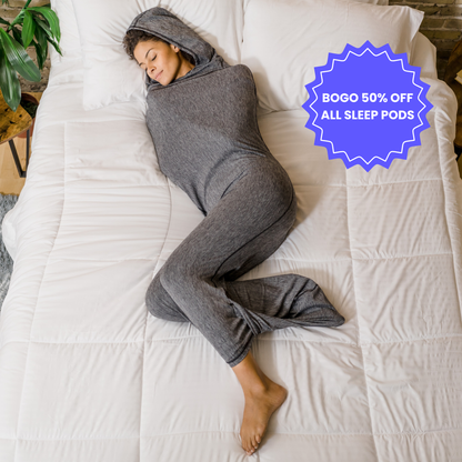 Woman in graphite color sleep pod in bed -  badge that says "BOGO 50% OFF ALL SLEEP PODS" 