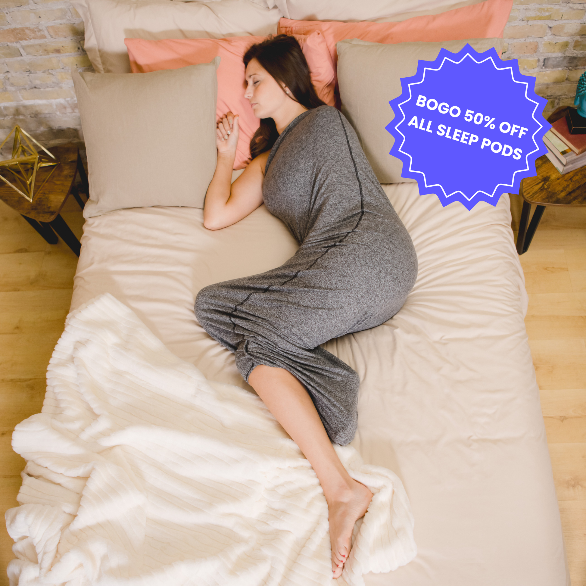 Graphite#woman laying in bed with sleep pod asleep - badge that says "BOGO 50% OFF ALL SLEEP PODS" and "OUR SPRING SALE IS LIVE"