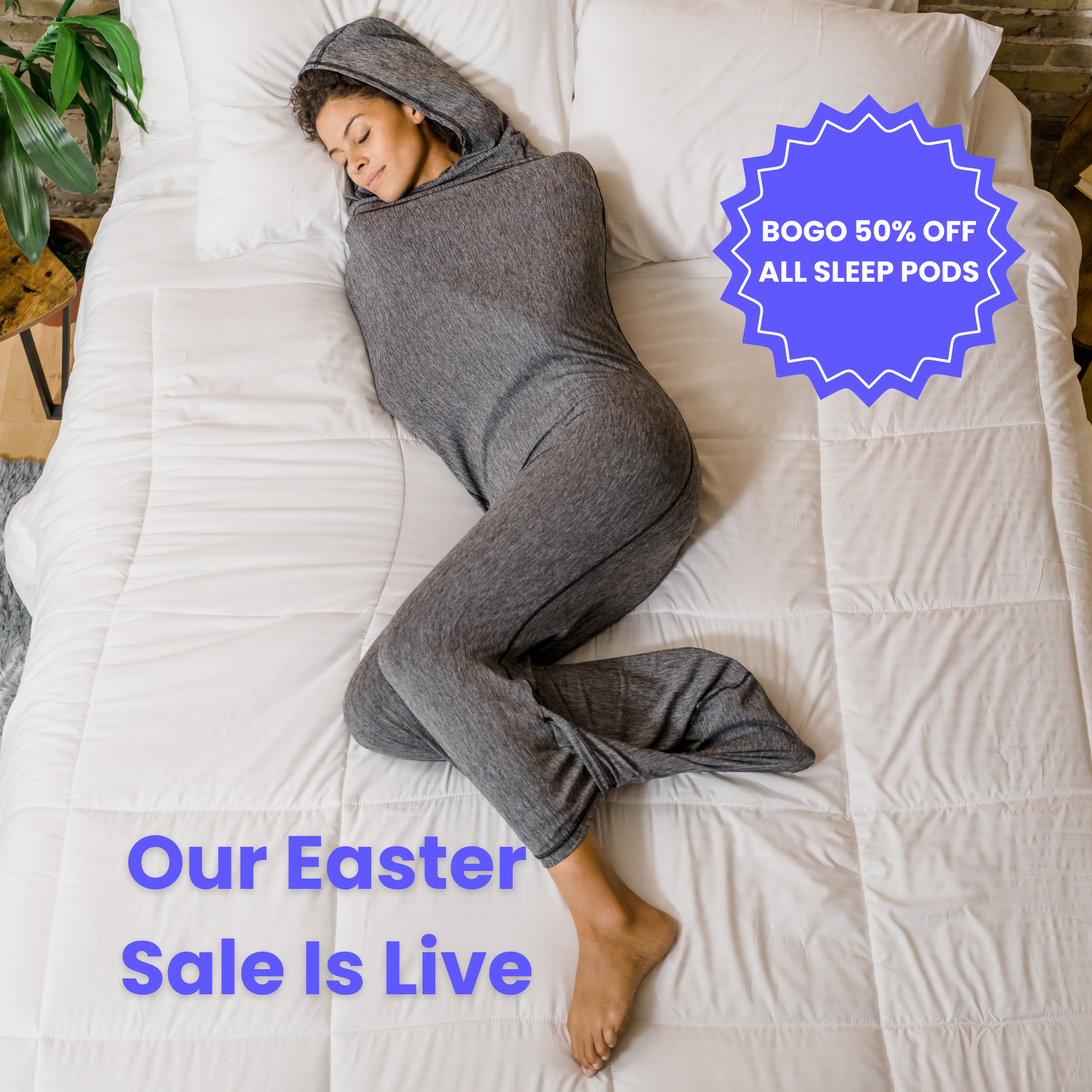 Woman in graphite color sleep pod in bed -  badge that says "BOGO 50% OFF ALL SLEEP PODS" and "OUR EASTER SALE IS LIVE"
