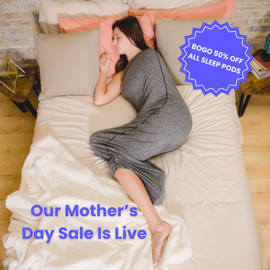 Graphite#woman laying in bed with sleep pod asleep - badge that says "BOGO 50% OFF ALL SLEEP PODS" and "OUR MOTHER'S DAY SALE IS LIVE"
