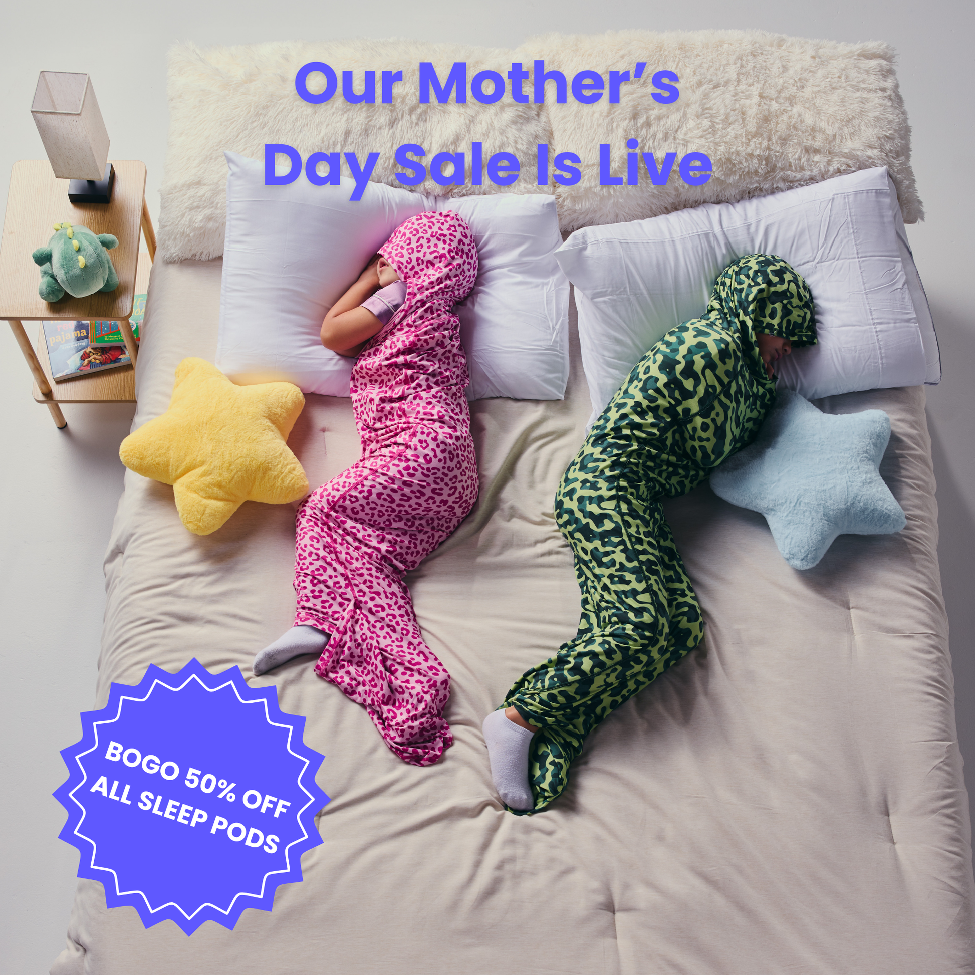 Kid in pink sleep pod and another kid in camo sleep pod laying in bed -  badge that says "BOGO 50% OFF ALL SLEEP PODS" and "OUR MOTHER'S DAY SALE IS LIVE"