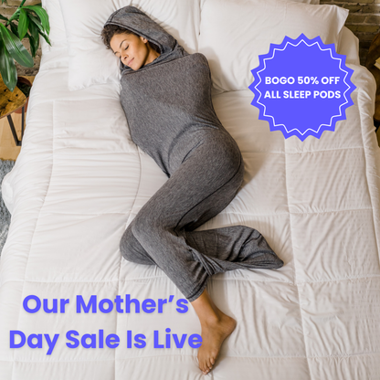 Woman in graphite color sleep pod in bed -  badge that says "BOGO 50% OFF ALL SLEEP PODS" and "OUR MOTHER'S DAY SALE IS LIVE"