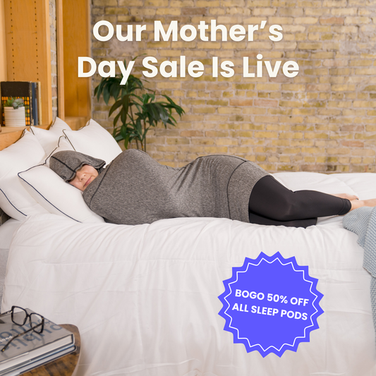 woman-in-bed-in-sleep-pod-mini-graphite-color-badge-that-says-bogo-50-off-all-sleep-pods-and-our-mothers-day-sale-is-live