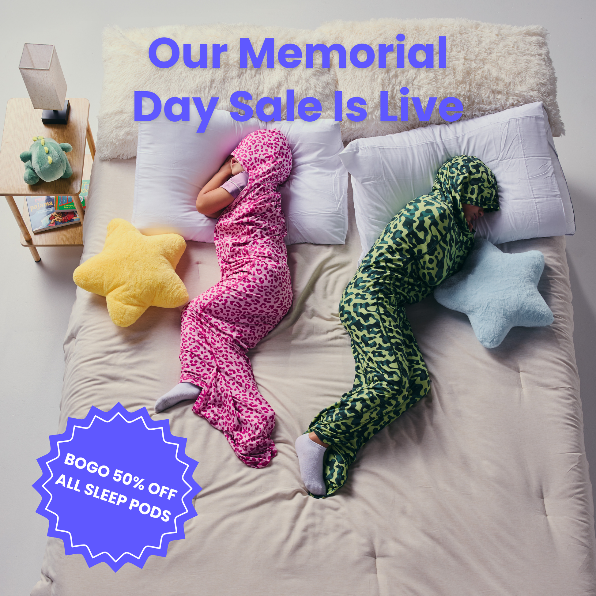 Kid in pink sleep pod and another kid in camo sleep pod laying in bed -  badge that says "BOGO 50% OFF ALL SLEEP PODS" and "OUR MEMORIAL DAY SALE IS LIVE"