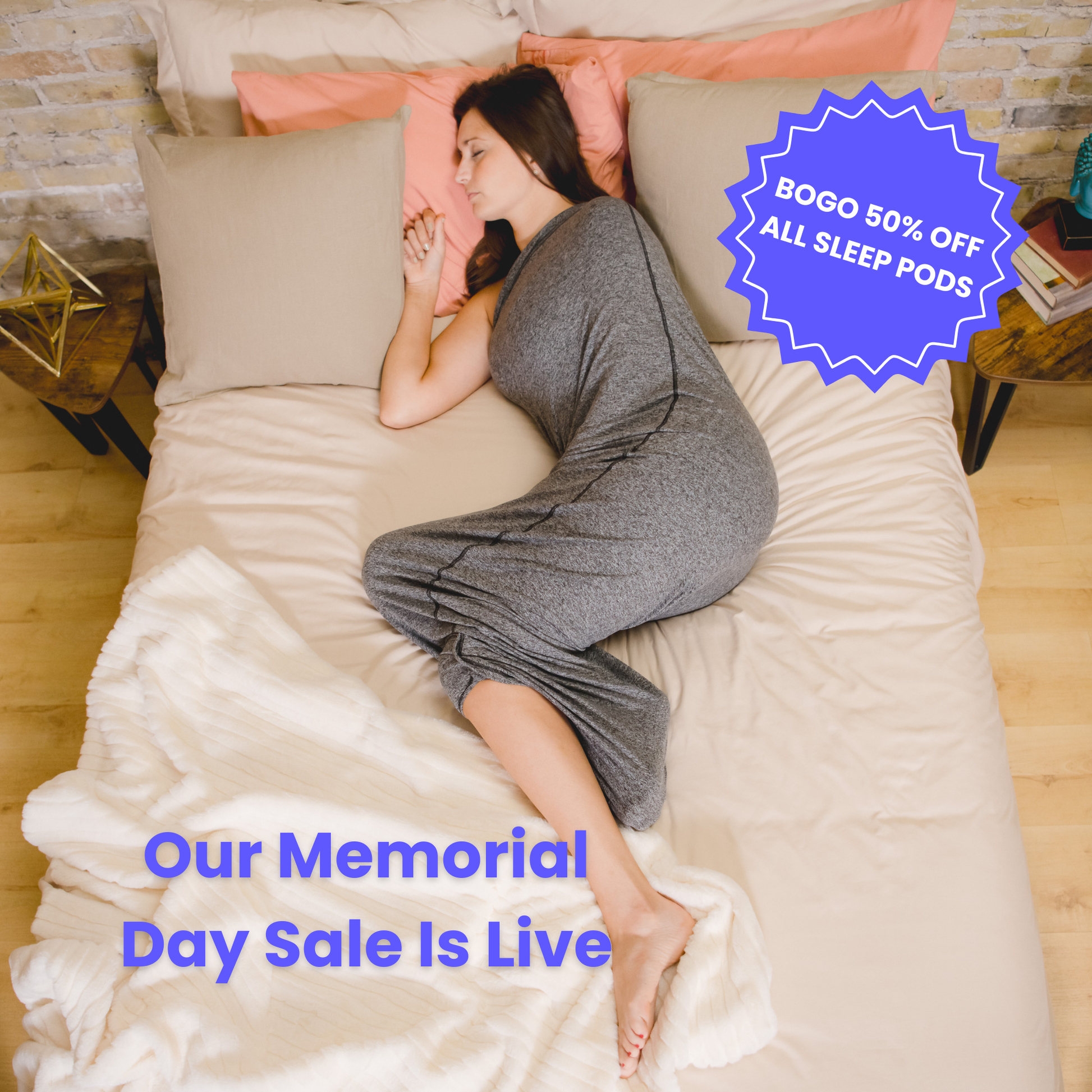 Graphite#woman laying in bed with sleep pod asleep - badge that says "BOGO 50% OFF ALL SLEEP PODS" and "OUR MEMORIAL DAY SALE IS LIVE"