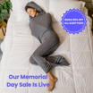 Woman in graphite color sleep pod in bed -  badge that says "BOGO 50% OFF ALL SLEEP PODS" and "OUR MEMORIAL DAY SALE IS LIVE"