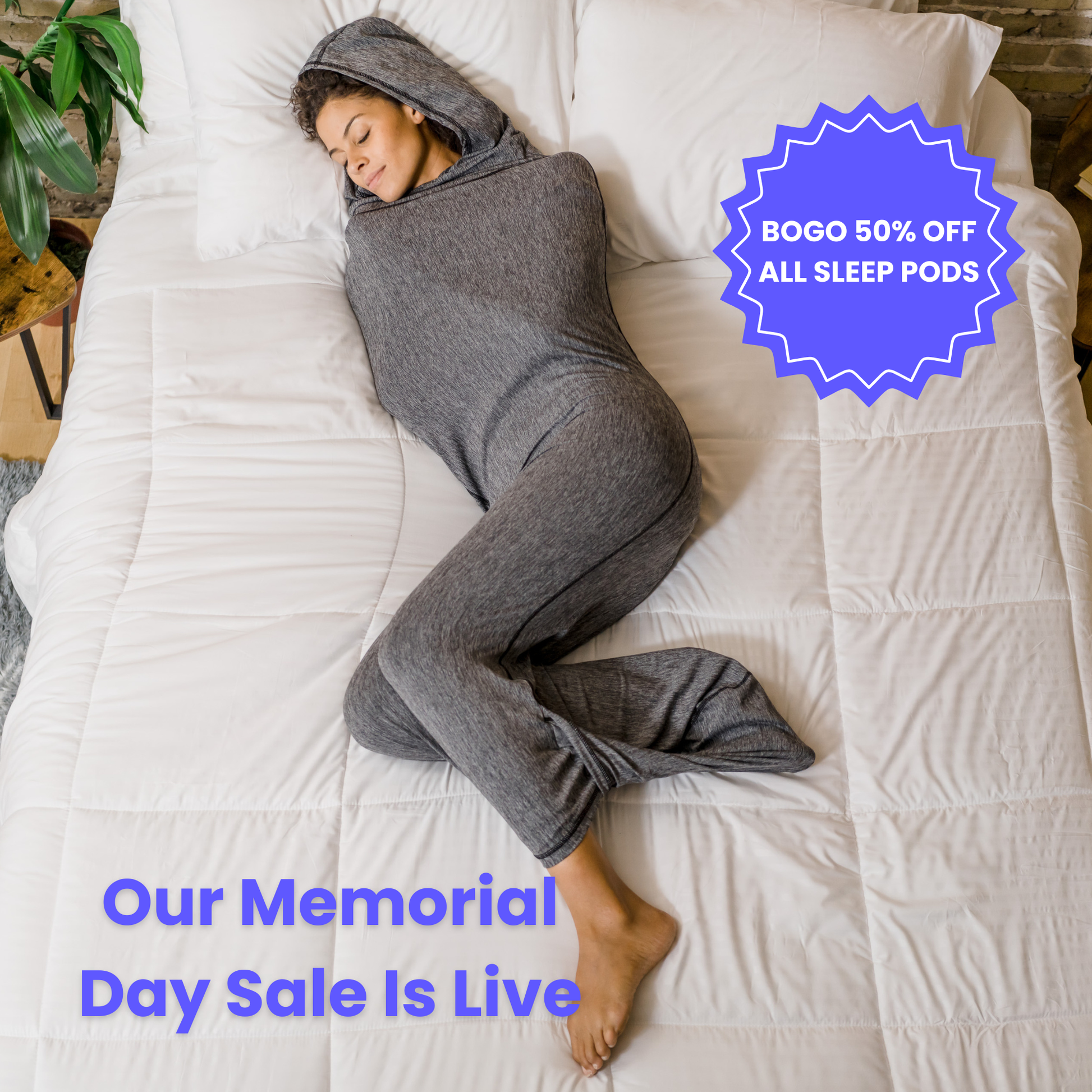 Woman in graphite color sleep pod in bed -  badge that says "BOGO 50% OFF ALL SLEEP PODS" and "OUR MEMORIAL DAY SALE IS LIVE"