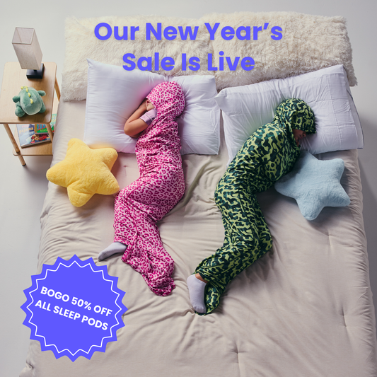 Kid in pink sleep pod and another kid in camo sleep pod laying in bed -  badge that says "BOGO 50% OFF ALL SLEEP PODS" and "OUR NEW YEAR'S SALE IS LIVE"