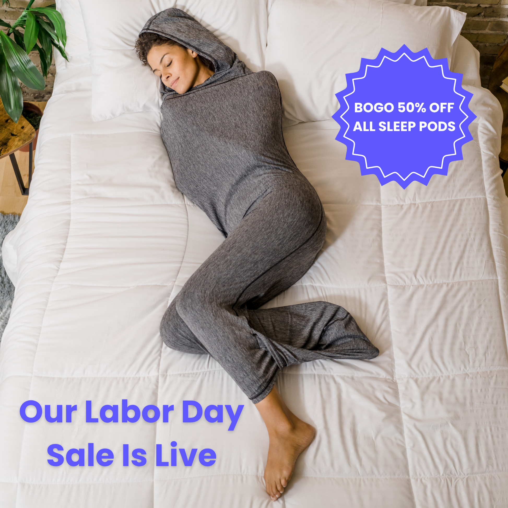 Woman in graphite color sleep pod in bed -  badge that says "BOGO 50% OFF ALL SLEEP PODS" and "OUR LABOR DAY SALE IS LIVE"