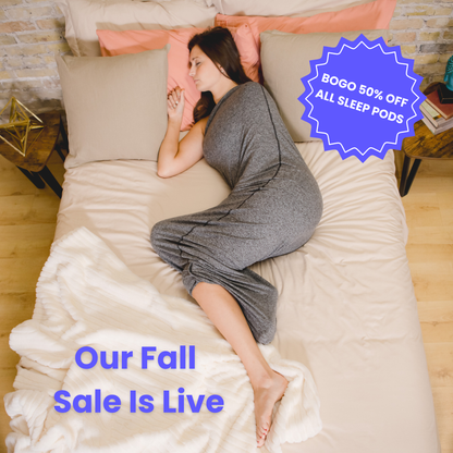 a woman in a graphite sleep pod laying in bed -  badge that says "BOGO 50% OFF ALL SLEEP PODS" and "OUR FALL SALE IS LIVE"