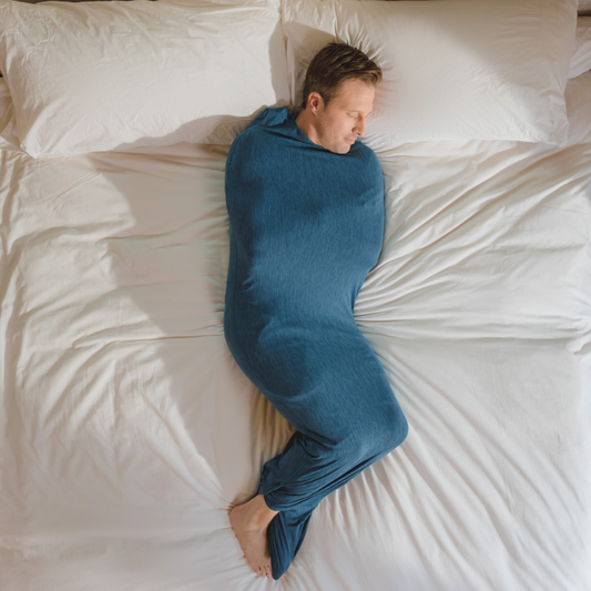 man-in-sleep-pod-in-bed