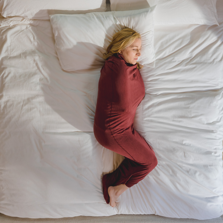 woman in sleep pod in bed
