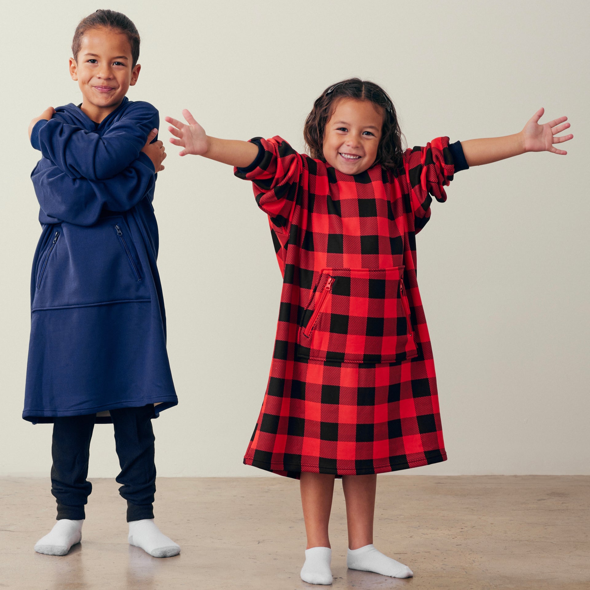 Boy and girl wearing Kids hug hoodies