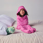 Pink# kids in pink sleep pod on bed