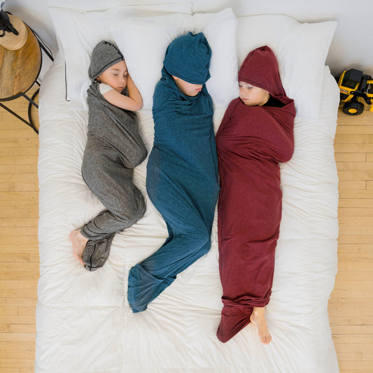 three-kids-sleeping-in-sleep-pods