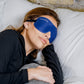woman laying with sleep mask