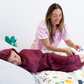 Ruby#Mom helping tuck child into blanket at bedtime