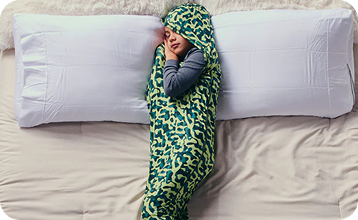 Child sleeping comfortably in the Sleep Pod Junior