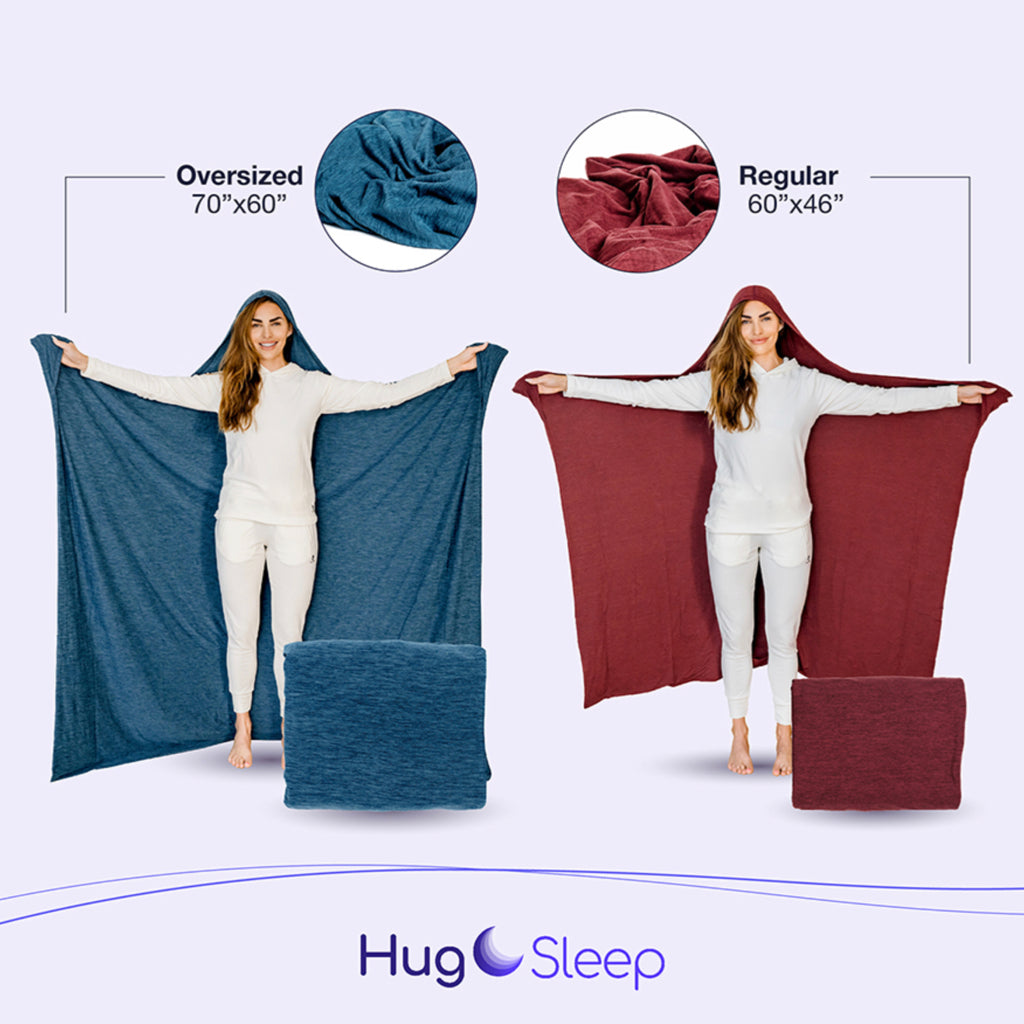Image showing one woman holding the regular sized and one holding the oversize Hug wrap. Dimensions of oversize are 70"x60" and regular is 60" by 46". The Hug Sleep Logo is also present on the bottom of the image.