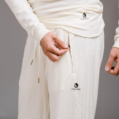 man wearing hug sleep loungewear in cream cream