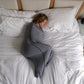 Woman in Sleep Pod sleeping on bed